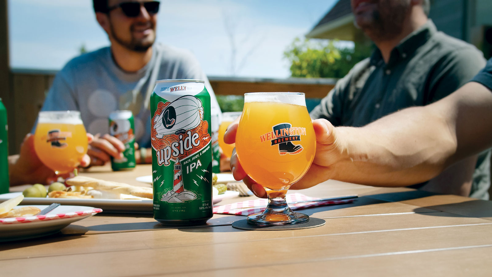 Cans of beer being enjoyed on patio