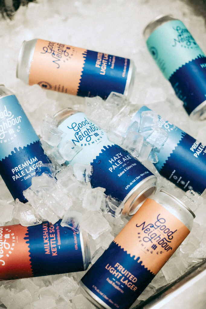 Various cans of Good Neighbour beers on ice
