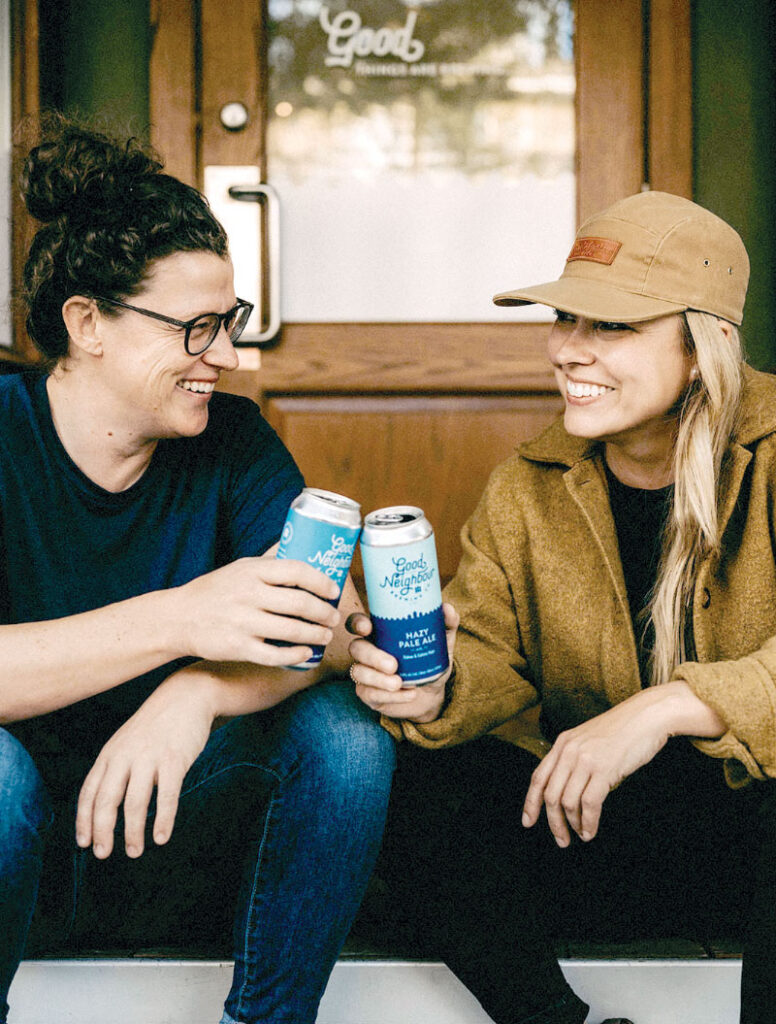 Amber and Morgain on front steps, enjoying a beverage