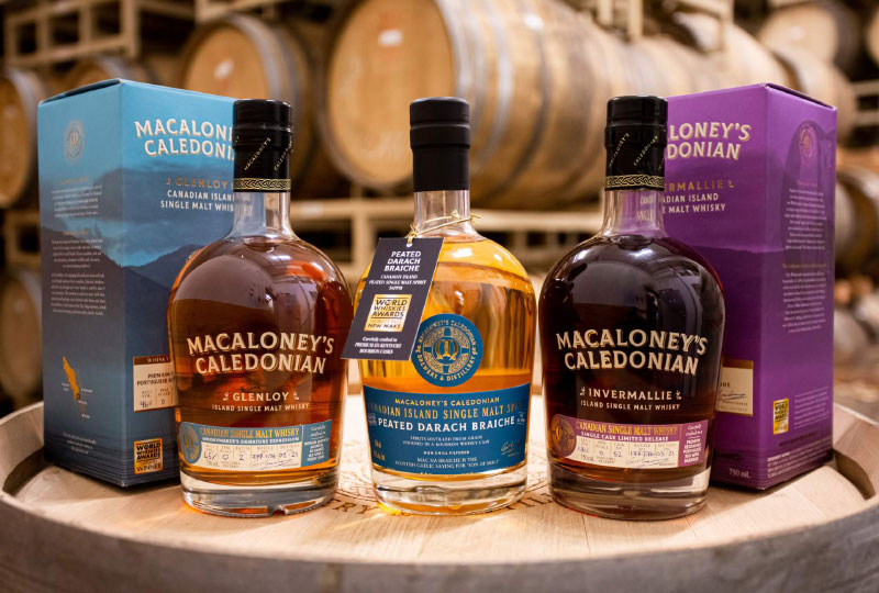 Bottles of whisky on barrel top display