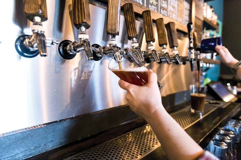 Pouring beer from tap to glass