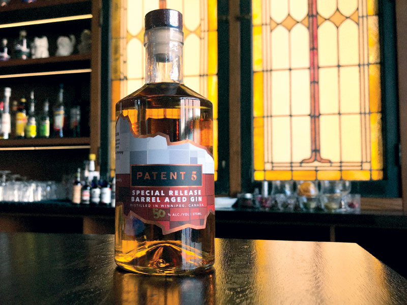 Bottle of barrel-aged gin on table