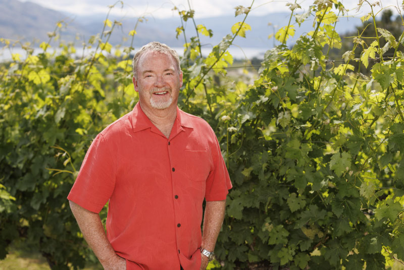 Tony Stewart standing in vineyard