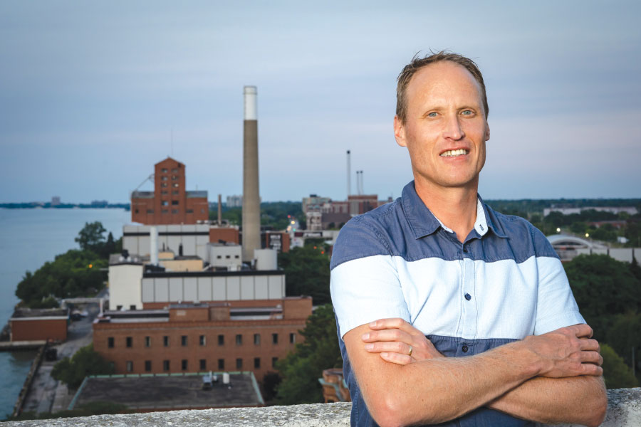 Don Livermore, PhD with Hiram Walker & Sons distillery in background