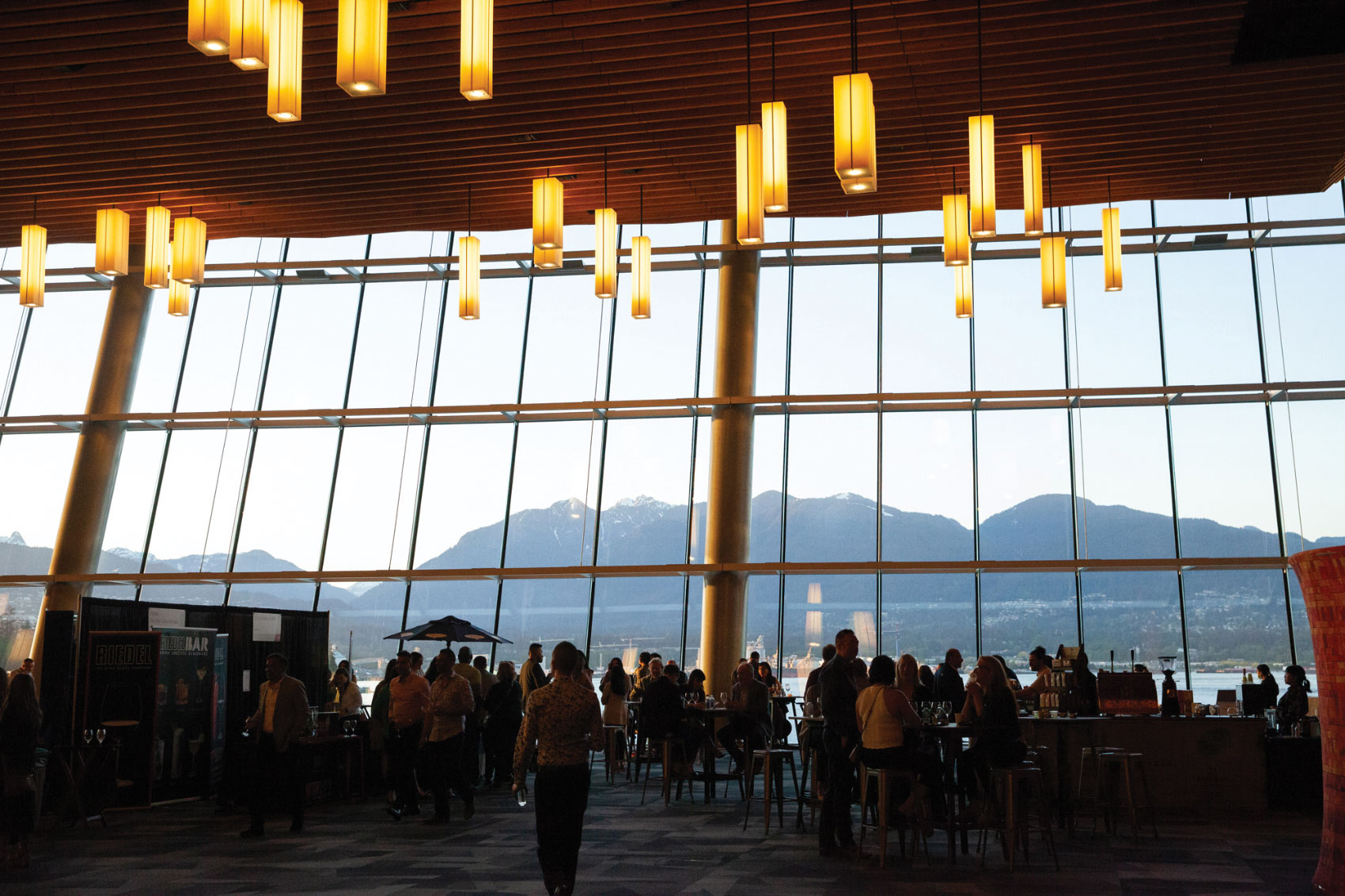 Inside convention room with floor-to-ceiling windows with view of mountains