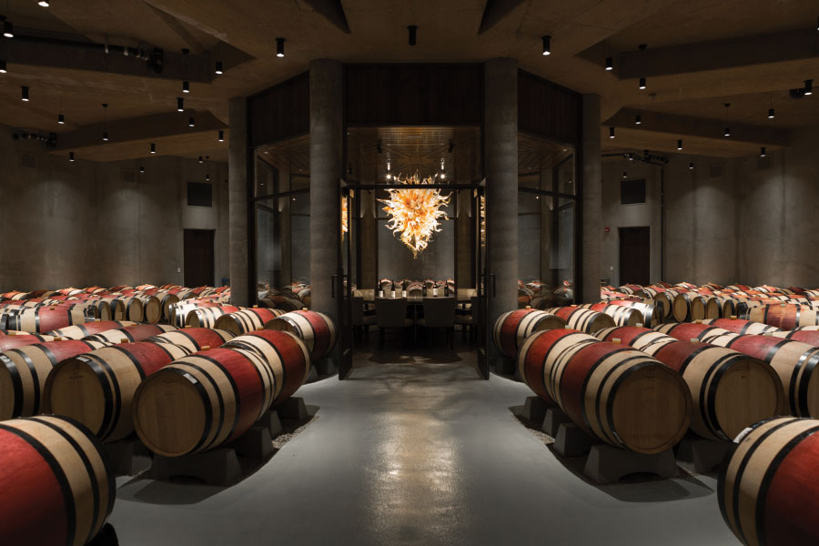 Wine barrels with art installation in background