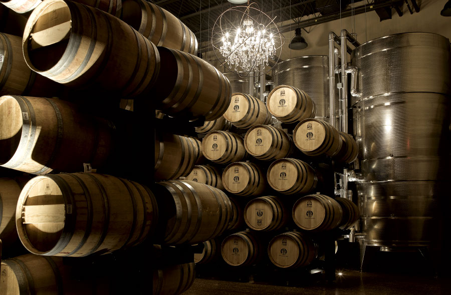 Stacks of wooden barrels in barrel room