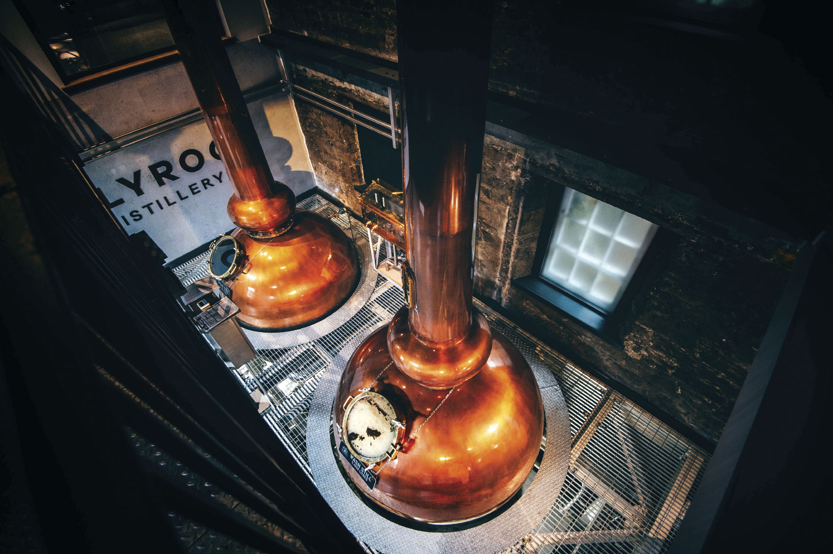 Overhead view of large copper stills
