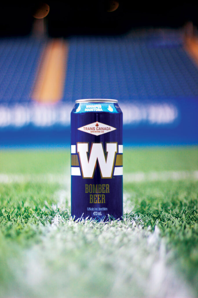 Can of Winnipeg Blue Bombers branded beer on football field