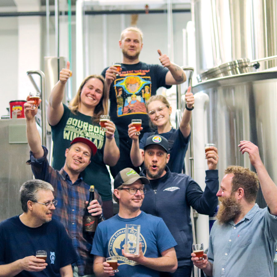 Workers gathered around for a team photo