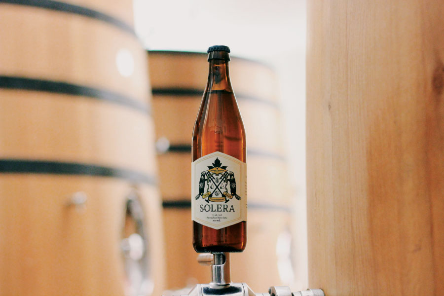 Bottle of Solera beer on a small pedestal