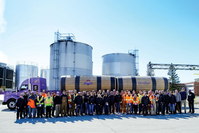 Group photo in front of Crown Royal Rig