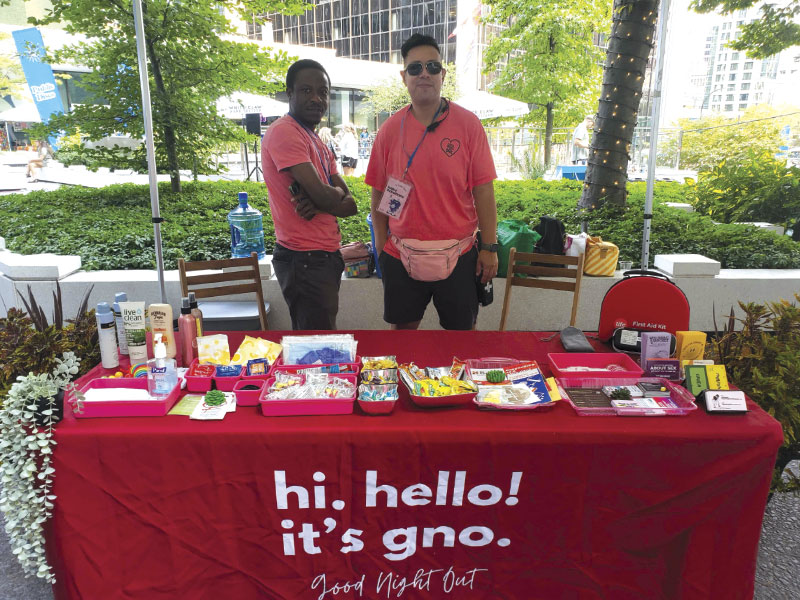 Volunteers at vendor booth