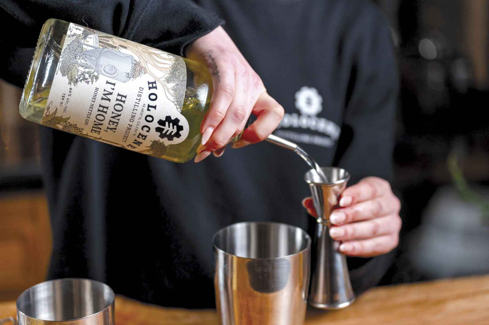 Aisling pouring liquor from bottle