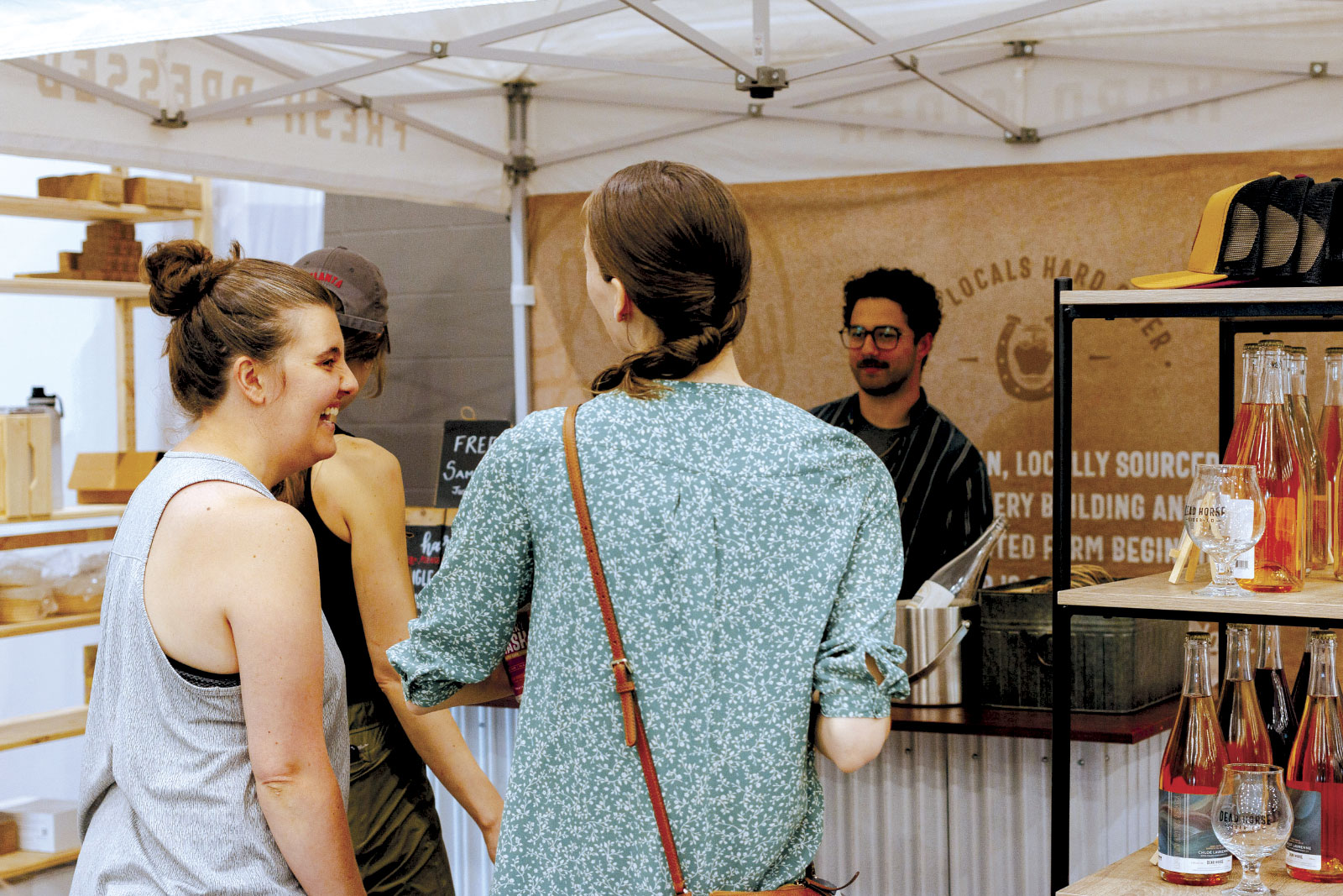 Attendees at the Dead Horse Cider Co. vendor booth