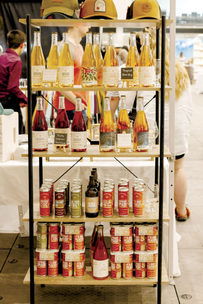 Various bottles on display at the Dead Horse Cider Co. booth