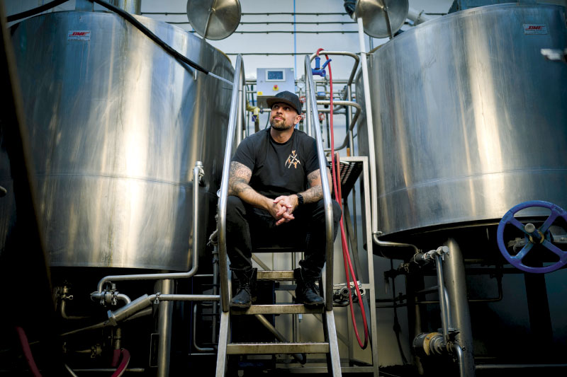Tim Weaver sitting between stills
