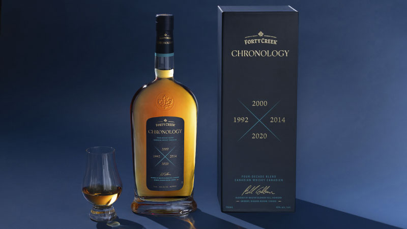 Bottle of Forty Creek Chronology and snifter on wood table