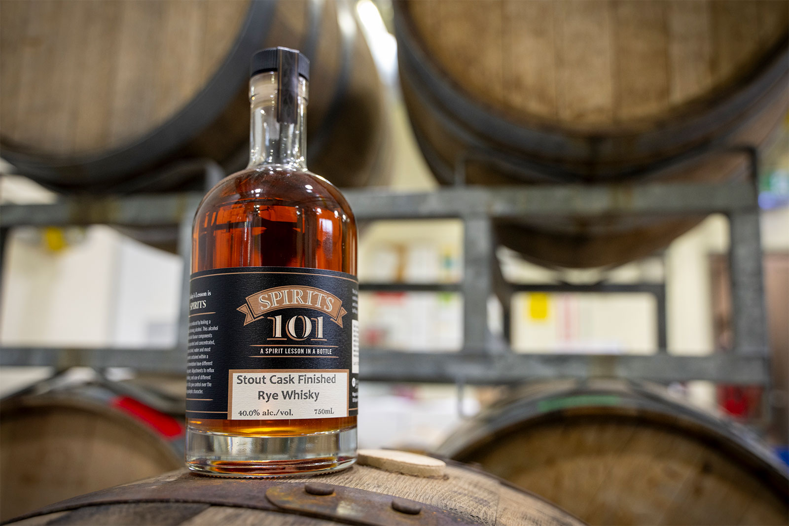 Bottle of Teaching Distillery’s Stout Cask Whisky on barrel