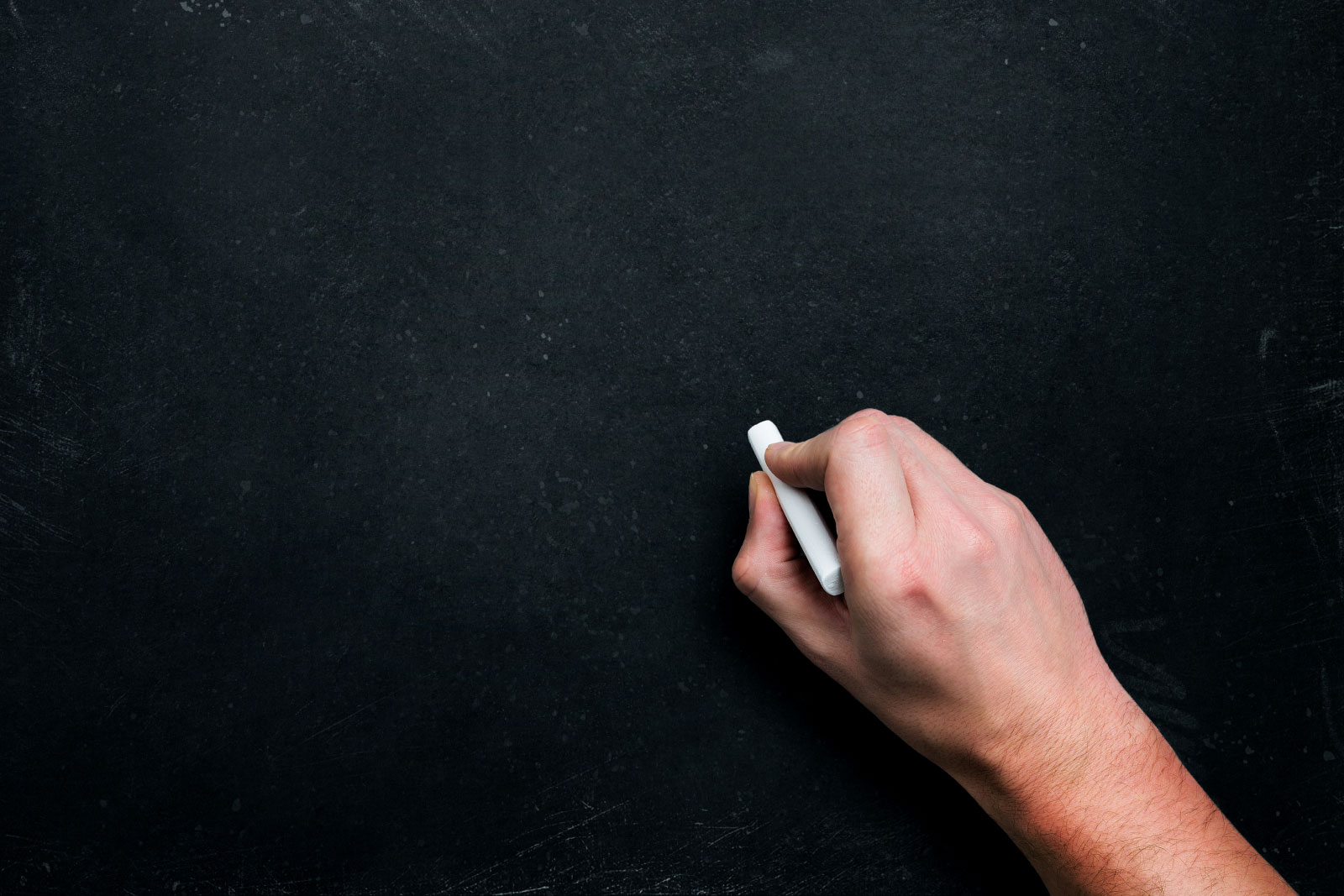 Hand with chalk, ready to write