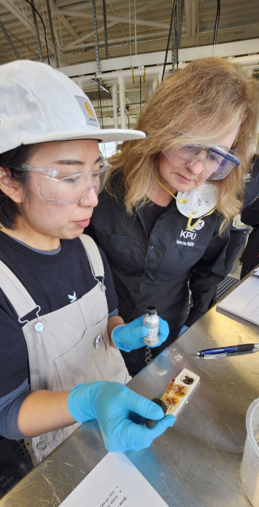Maria Yun and Lana Mihell examining samples