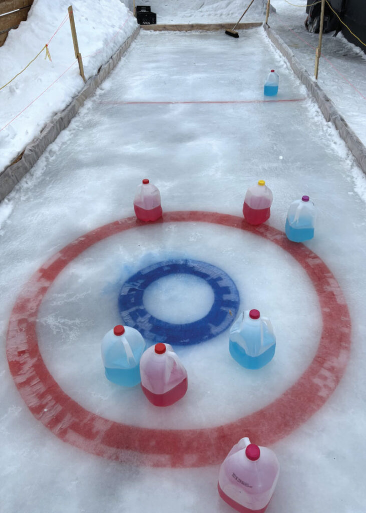 Milk jug curling setup on rooftop patio
