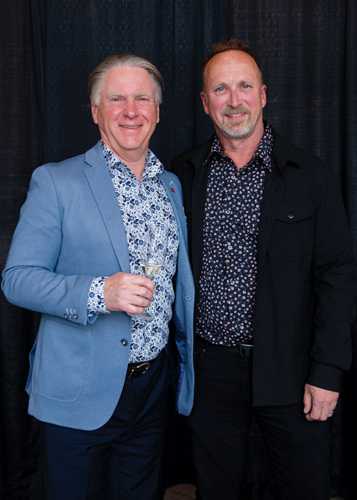 Two men posing for photo