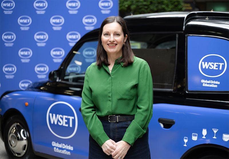 Michelle Brampton posing in front of branded vehicle