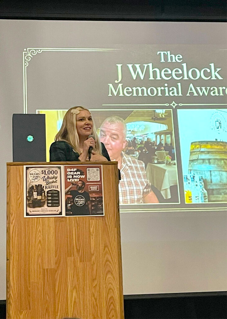 Pamela Dobbin giving speech at podium