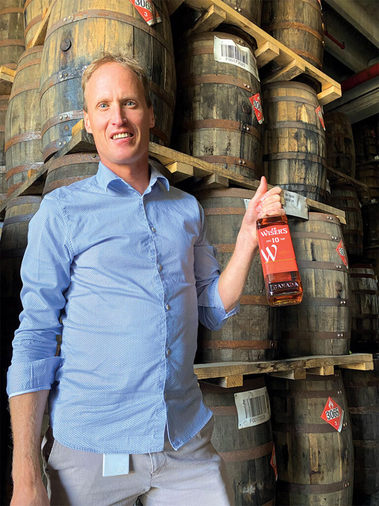 Don, holding bottle of J.P. Wiser's 10 Year Old Canadian Whisky