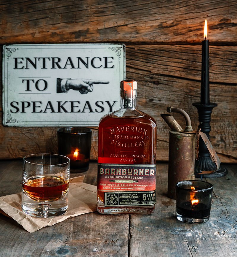 Bottle of Barnburner Whisky with vintage props