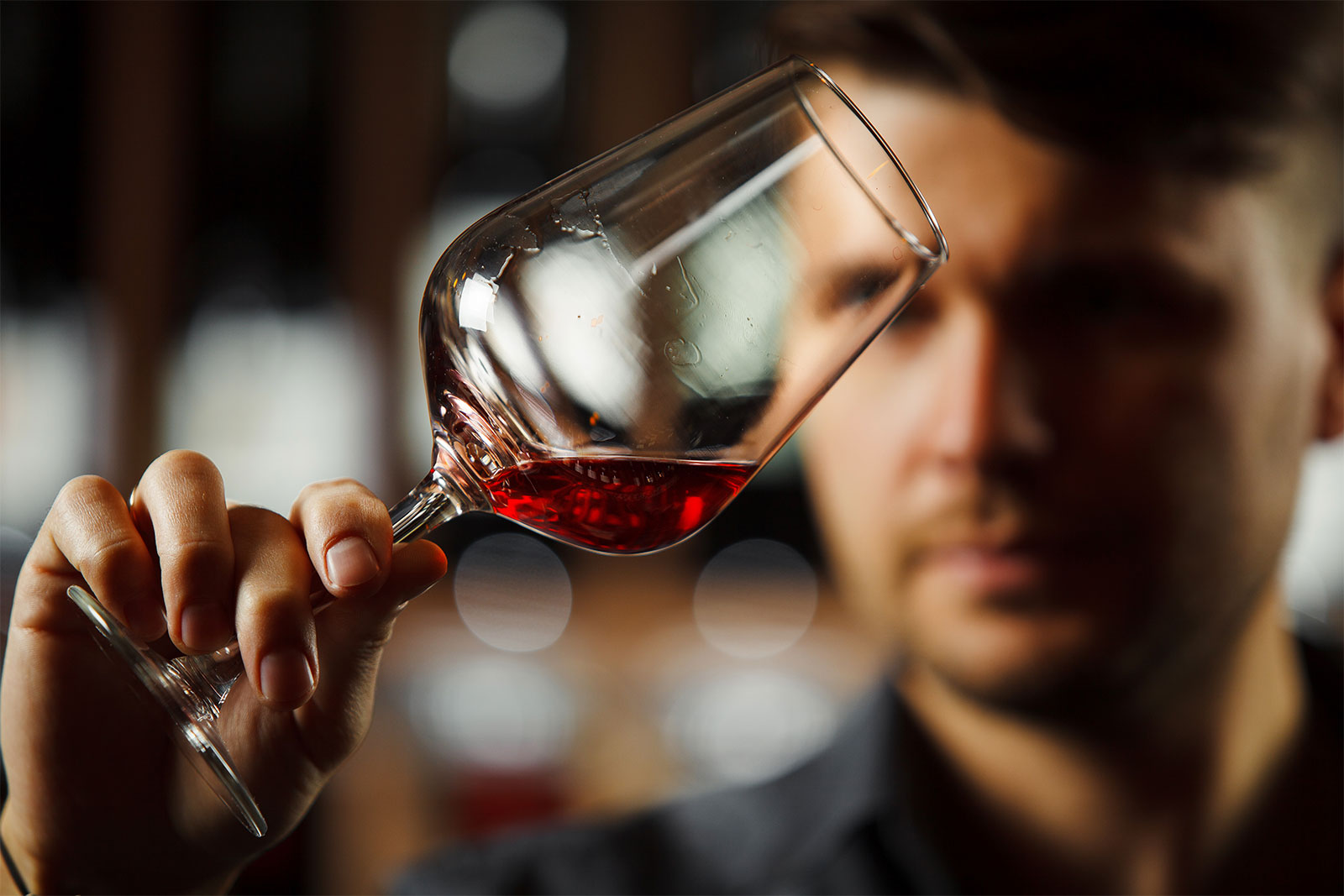 Sommelier with glass of wine in hand